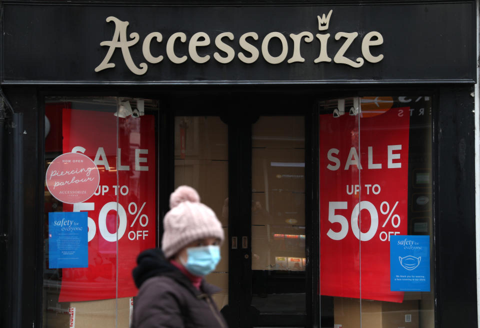 A person walks past a closed Accessorize shop on the High street in Winchester, Hampshire. Millions more people have moved to harsher coronavirus restrictions today as the new tier changes came into force in England. (Photo by Andrew Matthews/PA Images via Getty Images)