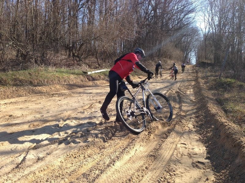 Soft, sandy soil is a challenge for Melting Mann racers to deal with on Mann Road, just after crossing Patterson Hill Road and just beyond Swiss Valley Ski & Snowboard Area in Jones, as seen in a prior year.