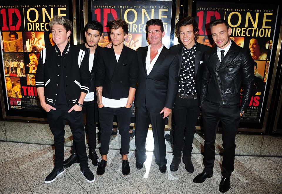 One Direction are practically bezzies with Simon Cowell. Copyright: [PA] 