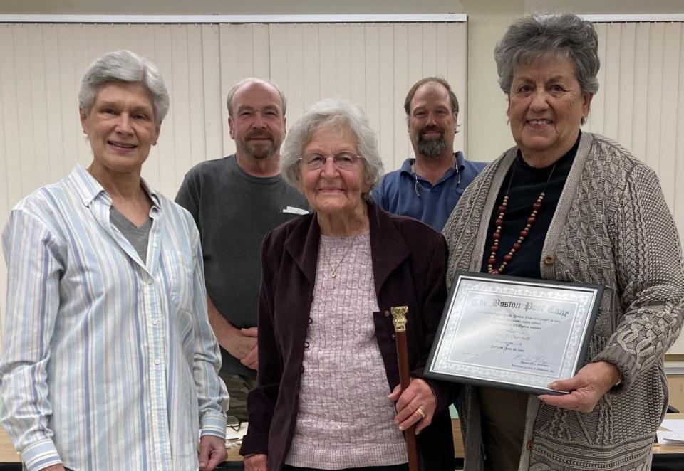 Jean Marshall was presented the Boston Post Cane at Phillipston Selectmen's meeting. Linda Langevin who presented the cane from the Historical Society, Selectman Bernie Malouin, Jean holding the cane, Selectman Gerhard Fandreyer, and Emelda Haughton who told the cane's history.