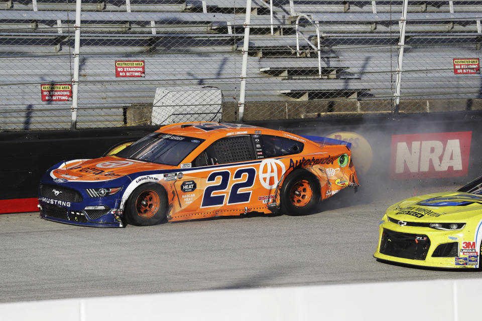 Joey Logano (22) drives the final lap in a NASCAR Cup Series auto race at Bristol Motor Speedway Sunday, May 31, 2020, in Bristol, Tenn. Logano had taken the lead but collided with Chase Elliott with three laps remaining. Their cars made contact in the fourth turn and drifted into the wall, allowing Brad Keselowski to come from third place for the win. (AP Photo/Mark Humphrey)