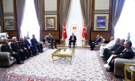 Turkey's President Tayyip Erdogan (C) meets with Turkey's Chief of Staff General Hulusi Akar (6th L), Defense Minister Fikri Isik (6th R) and the members of High Military Council at the Presidential Palace in Ankara, Turkey, July 29, 2016. Kayhan Ozer/Presidential Palace/Handout via REUTERS