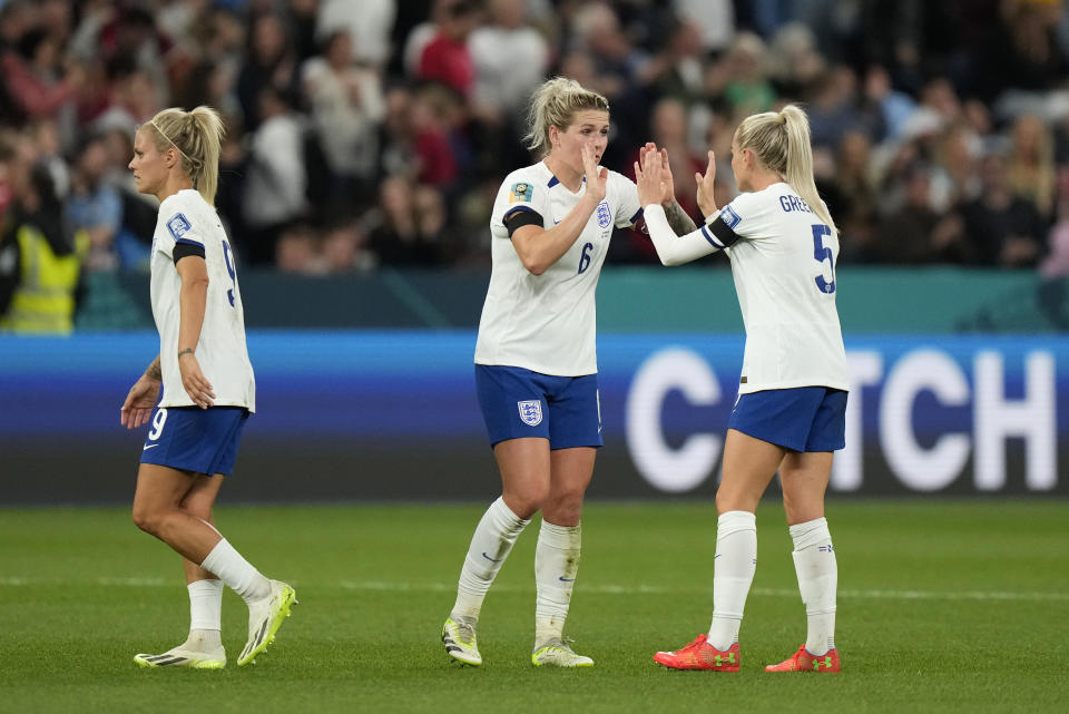 England's Alex Greenwood, right, Millie Bright, center, and Rachel Daly react after the Women's World Cup Group D soccer match between England and Denmark at the Sydney Football Stadium in Sydney, Australia, Friday, July 28, 2023. England won the match 1-0. (AP Photo/Rick Rycroft)