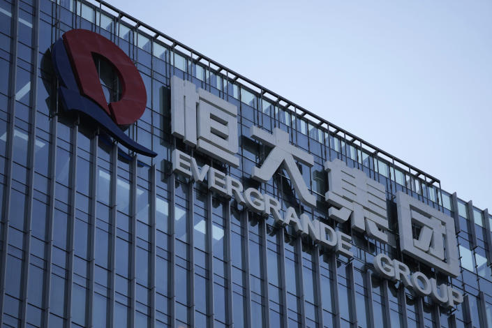 The Evergrande Group headquarters logo is seen in Shenzhen in southern China's Guangdong province, Friday, Sept. 24, 2021. Troubled Chinese developer Evergrande Group whose struggle to avoid a multibillion-dollar debt default has rattled global financial markets made an overdue $45.2 million payment on a bond Friday, one day before it would have been declared in default, a newspaper reported. (AP Photo/Ng Han Guan)