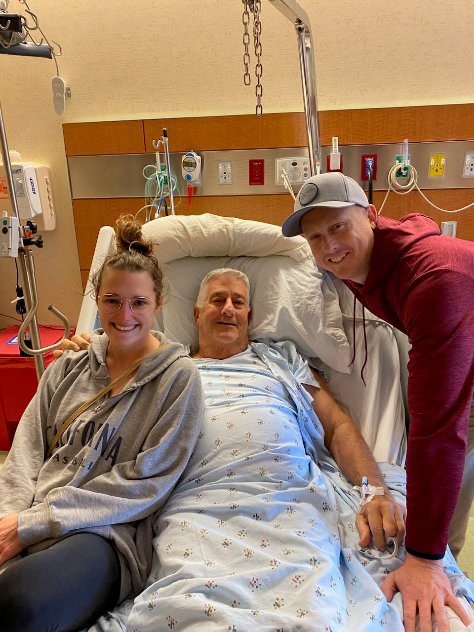 Kaitie Goodwin and Perry Hess visit Pat O'Shaughnessy, center, after successful surgery to remove a cancerous tumor from his kidney. A longtime friend of Goodwin's family, O'Shaughnessy had planned to donate his kidney to Hess, but those plans changed after cancer was found.