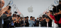 <p>Apple fans flock to get their hands on the redesigned products at the California launch. (Reuters) </p>