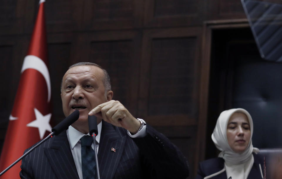 Turkey's President Recep Tayyip Erdogan addresses his ruling party MPs, in Ankara, Turkey, Tuesday, June 25, 2019, two days after Ekrem Imamoglu, the candidate of the secular opposition Republican People's Party, won the election for mayor of Istanbul. Erdogan addressed his AK Party's weekly meeting, the first time he speaks since the Istanbul mayoral election Sunday, which was a big setback for him and his party.(AP Photo/Burhan Ozbilici)