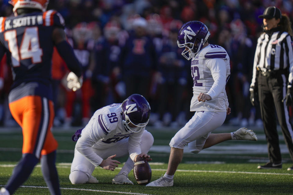Northwestern place-kicker Jack Olsen (82) boots a field goal during the first half of an NCAA college football game against Illinois, Saturday, Nov. 25, 2023, in Champaign, Ill. (AP Photo/Erin Hooley)