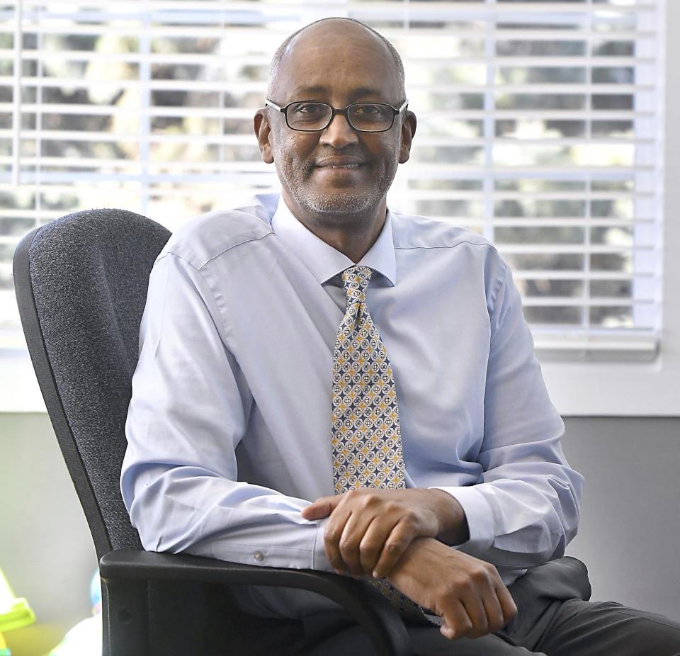 Abdi Sabrie works in his home office Thursday, March 11, 2021, in Eagle Lake, Minn. As Democrats continue to lose votes in small towns, they've seen clear gains in regional hubs that dot vast stretches of rural America. President Joe Biden carried roughly 60 counties that Donald Trump won in 2016, and many were places anchored by a midsized or small city that is trending Democratic. (AP Photo/Pat Christman)