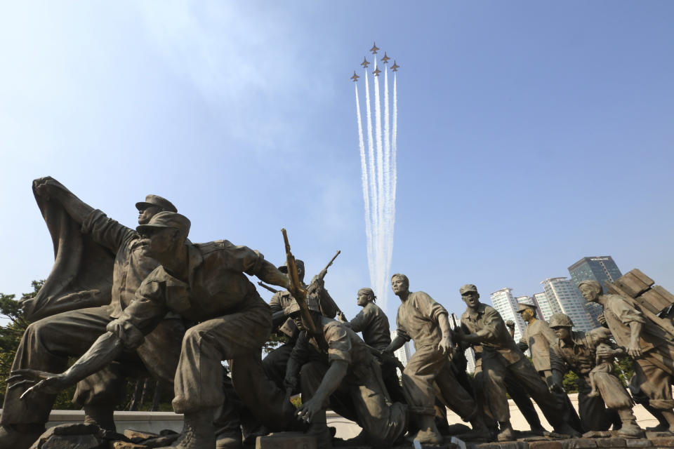 South Korea's Black Eagles aerobatic flight team performs over a monument in remembrance of the Korean War during a rehearsal for the upcoming ceremony of Changjin Lake Battle memorial day during the Korean War in 1950, at the Korea War Memorial Museum in Seoul, South Korea, Monday, Oct. 19, 2020. South Korea will hold the ceremony on Oct. 27. (AP Photo/Ahn Young-joon)