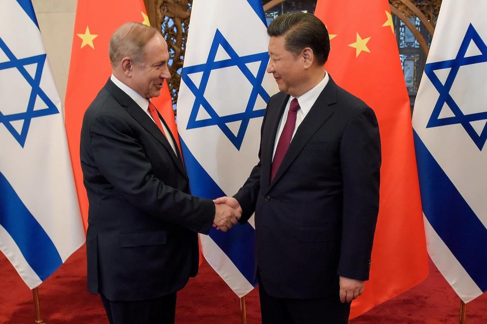 Israeli Prime Minister Benjamin Netanyahu shakes hands with China’s President Xi Jinping in 2017. <a href="https://www.gettyimages.com/detail/news-photo/chinas-president-xi-jinping-and-israels-prime-minister-news-photo/655959948?adppopup=true" rel="nofollow noopener" target="_blank" data-ylk="slk:Etienne Oliveau/AFP via Getty Images;elm:context_link;itc:0;sec:content-canvas" class="link ">Etienne Oliveau/AFP via Getty Images</a>