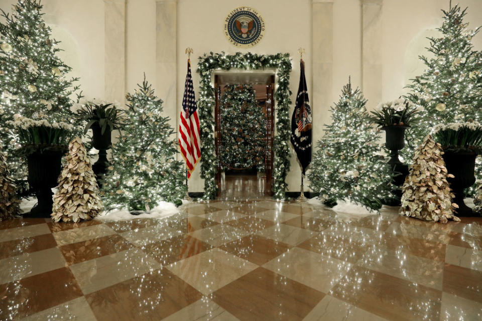 WASHINGTON, DC - DECEMBER 02: Christmas decorations are on display in the Grand Foyer at the White House December 2, 2019 in Washington, DC. The White House expects to host 100 open houses and more than 30,000 guests who will tour the topiary trees, architectural models of major U.S. cities, the Gold Star family tree and national monuments in gingerbread. (Photo by Mark Wilson/Getty Images)