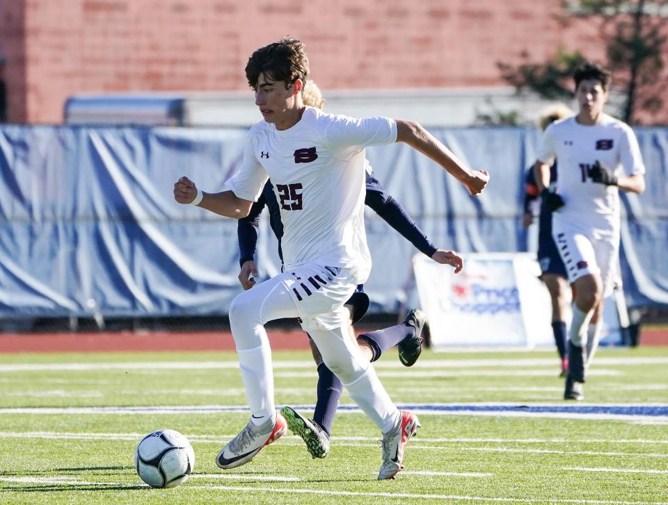 Scarsdale's Jose Alava Marino works the ball up field during their 4-1 win over Smithtown West in the NYSPHSAA boys soccer Class AA semifinal at Middletown High School in Middletown on Saturday, November 2023.