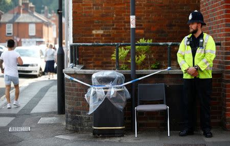 A police officer guards a cordoned off rubbish bin on Rolleston Street, after it was confirmed that two people had been poisoned with the nerve-agent Novichok, in Salisbury, Britain, July 5, 2018. REUTERS/Henry Nicholls