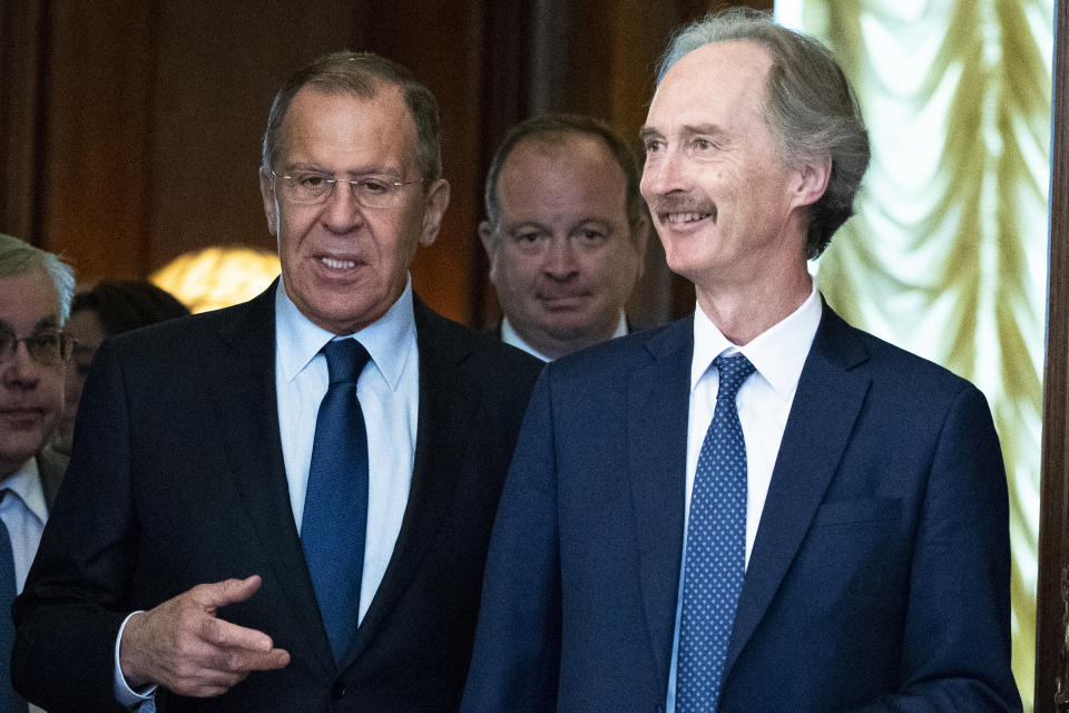 United Nations Special Envoy for Syria Geir Pedersen, center, and Russian Foreign Minister Sergey Lavrov, second from right, enter a hall during their meeting in Moscow, Russia, Friday, July 5, 2019. Pedersen voiced hope that cooperation between Russia and Turkey will help stabilize the situation in Syria's northwestern provice of Idlib. (AP Photo/Pavel Golovkin)