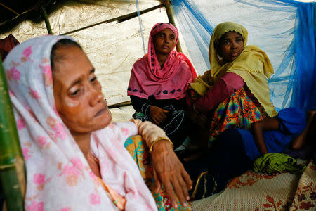 Bula Katum (R), 35, a Rohingya refugee woman sits in a makeshift shelter at Kutupalang Makeshift Camp in Cox’s Bazar, Bangladesh, September 4, 2017. REUTERS/Mohammad Ponir Hossain