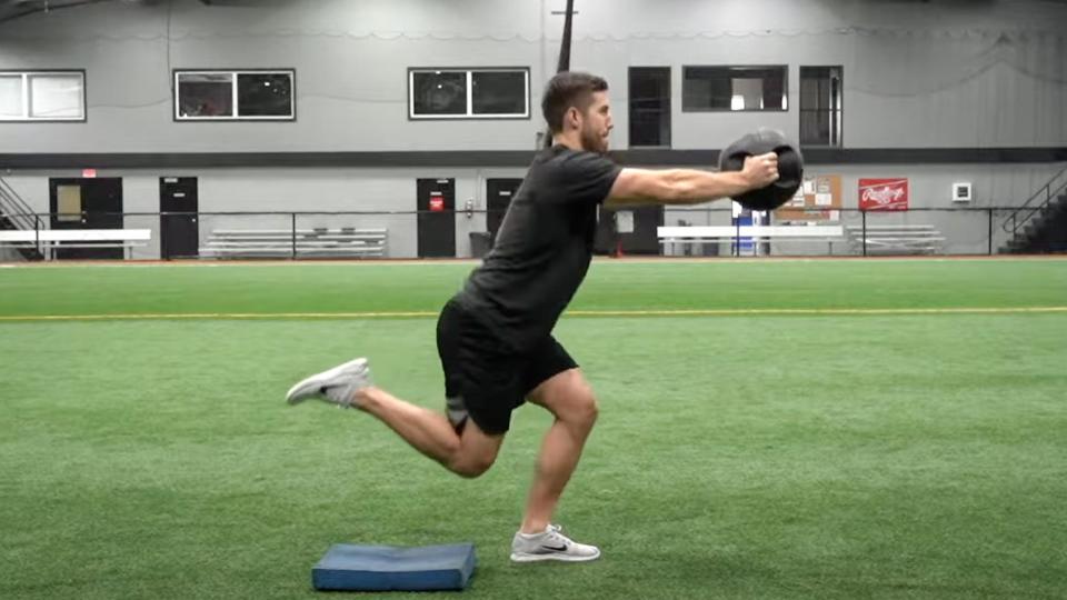 A man doing a skater squat exercise