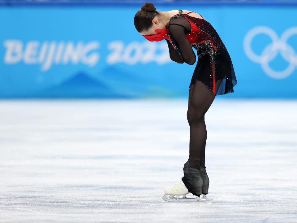 Kamila Valieva of Team ROC reacts after skating during the Women Single Skating Free Skating final at the Beijing Olympics.