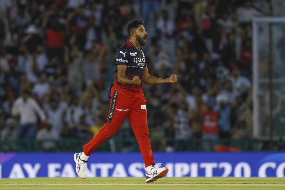 Royal Challengers Bangalore's Mohammed Siraj celebrate the dismissal of Punjab Kings Harpreet Brar during the Indian Premier League cricket match between Punjab Kings and Royal Challengers Bangalore in Mohali, India, Thursday, April 20, 2023. (AP Photo/Surjeet Yadav)