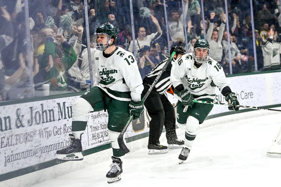 Michigan State's Tiernan Shoudy, left, celebrates his goal with teammate Jesse Tucker during the second period in the game against Michigan on Friday, Dec. 9, 2022, at Munn Arena in East Lansing.
