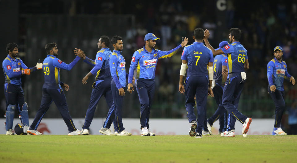 Sri Lankan team members celebrate their team's victory over Bangladesh by 122 runs in the third one-day international cricket match between Sri Lanka and Bangladesh in Colombo, Sri Lanka, Wednesday, July 31, 2019. (AP Photo/Eranga Jayawardena)
