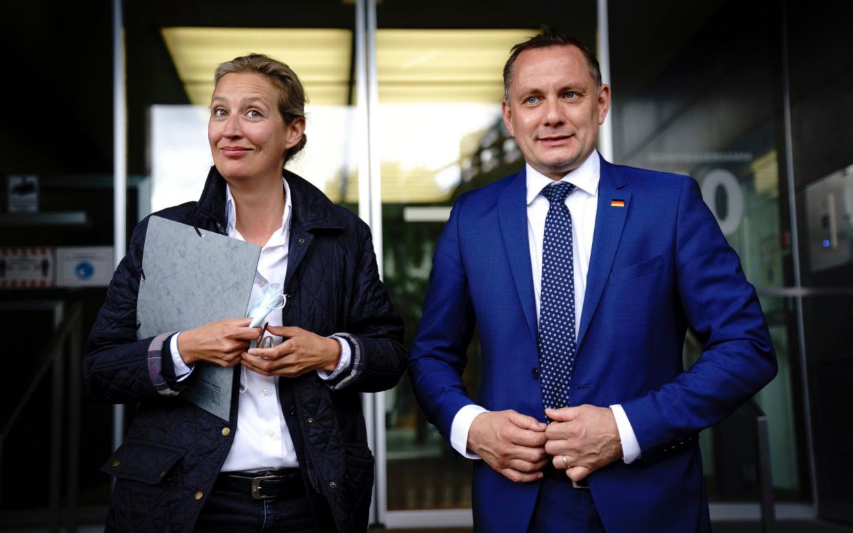 Alice Weidel, left, co-leader of the AfD parliamentary group in the Bundestag, and Tino Chrupalla, co-party leader, introduce themselves as the party's top candidates for the German parliament election in fall at a news conference in Berlin Tuesday, May 25, 2021 . (Kay Nietfeld/dpa via AP) - Kay Nietfeld/DPA