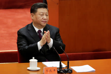Chinese President Xi Jinping applauds at an event marking the 40th anniversary of China's reform and opening up at the Great Hall of the People in Beijing, China December 18, 2018. REUTERS/Jason Lee