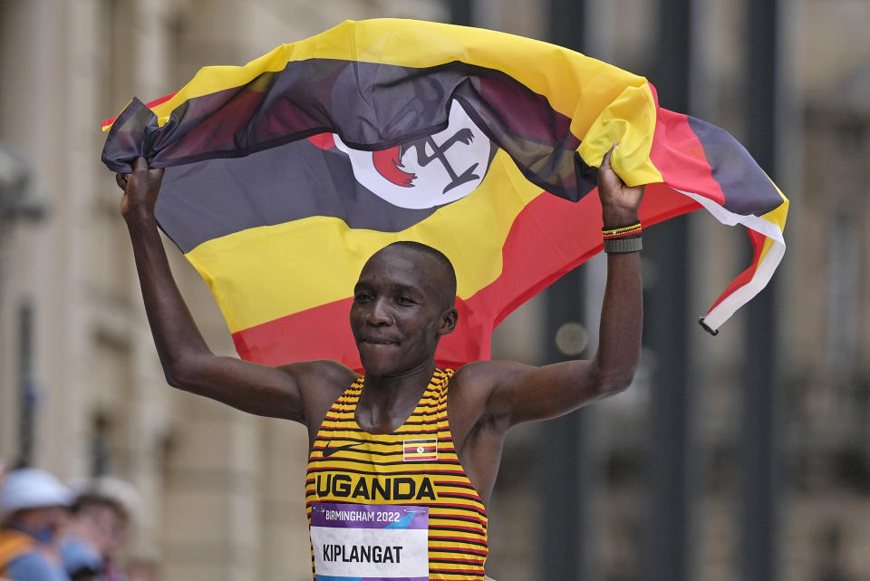 Victor Kiplangat of Uganda celebrates winning the gold medal in the men's marathon at the Commonwealth Games in Birmingham, England, Saturday, July 30, 2022. (AP Photo/Alastair Grant)