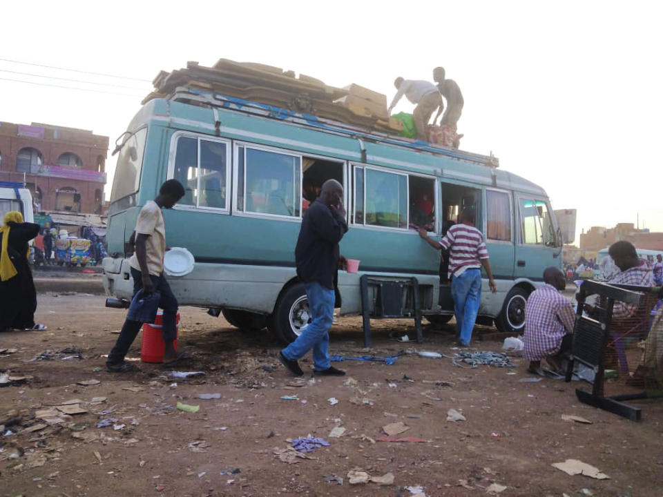 People board a bus preparing to leave Khartoum, Sudan, on Thursday, June 1, 2023. On Wednesday, heavy shelling near a market in a neighborhood in the south of the Sudanese capital of Khartoum killed at least 17 civilians, the Sudan Doctor's Syndicate said. (AP Photo)