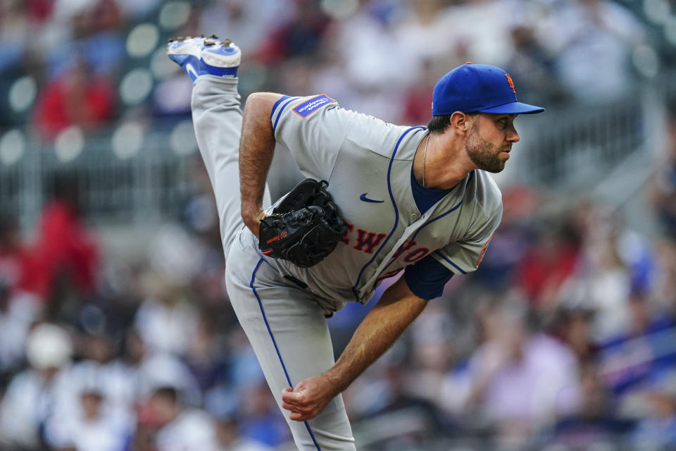 New York Mets starting pitcher David Peterson works against the Atlanta Braves in the first inning of a baseball game Monday, Aug. 21, 2023, in Atlanta. (AP Photo/John Bazemore)