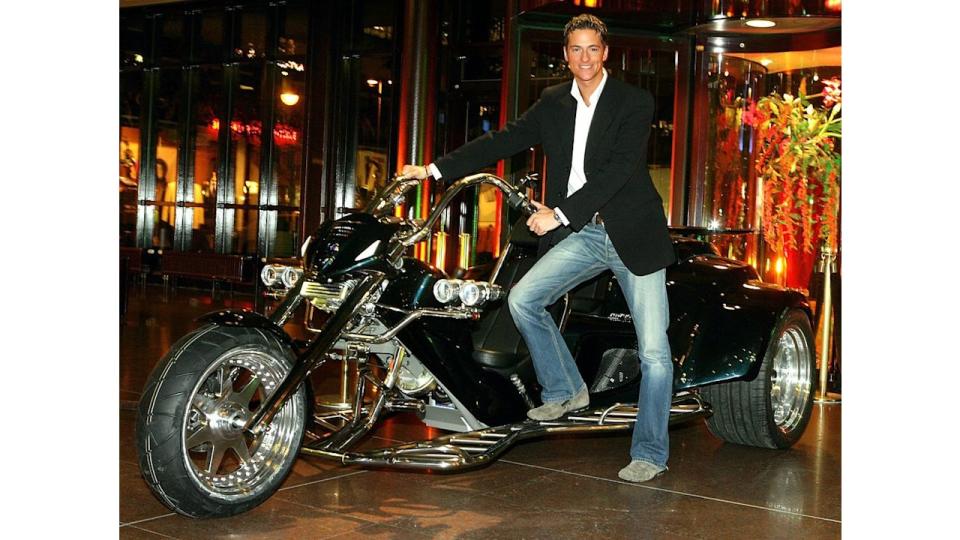 Sebastian Stahl with a three-wheeled motorcycle