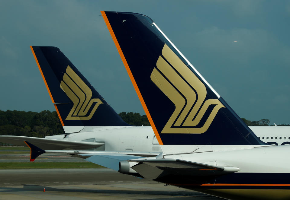 Singapore Airlines planes sit on the tarmac at Singapore's Changi Airport March 11, 2020. Picture taken March 11, 2020. REUTERS/Edgar Su