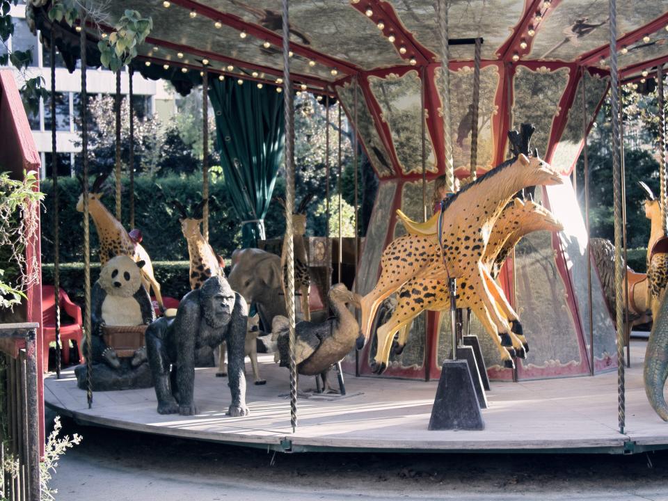 A carousel with dinosaurs and other extinct animals in Paris