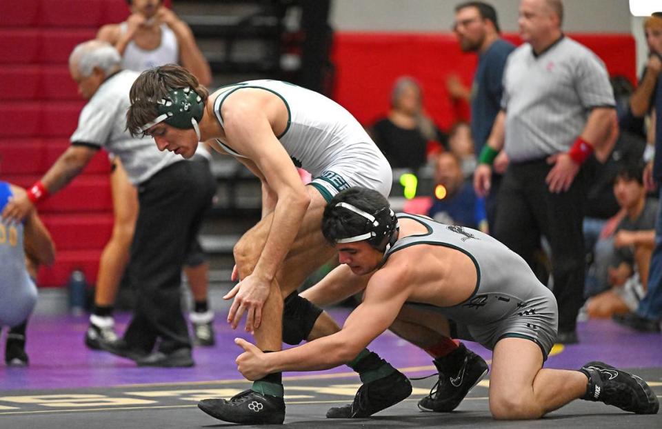 Mika Ontiveros, right, won his 146-pound match to seal the win for Pitman over Ponderosa in the D II Sac-Joaquin Section team wrestling championship at Lincoln High School in Stockton, Calif., Saturday, Jan. 27, 2024.