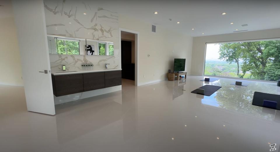 The double vanity in the upstairs fitness area of Aaron Rodgers' New Jersey home.