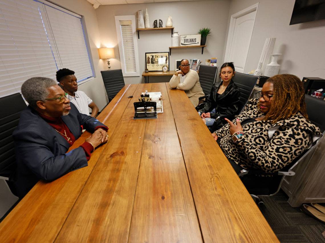 Advocate VJ Smith, (clockwise from left) participant Jeremy, 16, advocate Tyisha Heath, participant Grace, 16, and criminal defense attorney MarQuetta A. Clayton visit during a Youth Advocate Programs meeting in Fort Worth Texas, Wednesday Apr 03, 2024. The program has a staff of 22 that currently serve more than 65 participants. (Special to the Star-Telegram Bob Booth)