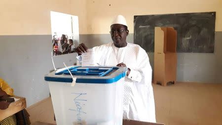 Soumaila Cisse, leader of URD (Union for the Republic and Democracy), an opposition party, casts his vote at a polling station during the presidential election in Niafunke, an area of Timbuktu, Mali July 29 2018. Soumaila Cisse Staff/Handout via REUTERS