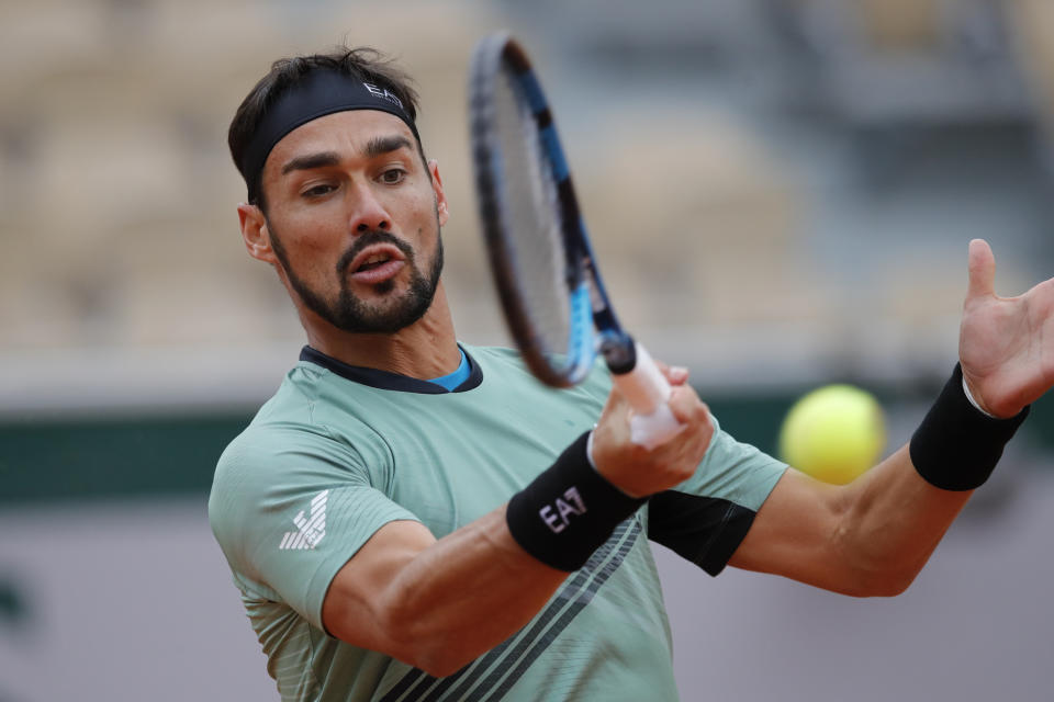 Italy's Fabio Fognini plays a shot against Kazakhstan's Mikhail Kukushkin in the first round match of the French Open tennis tournament at the Roland Garros stadium in Paris, France, Monday, Sept. 28, 2020. (AP Photo/Christophe Ena)