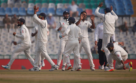 Cricket - India v England - Third Test cricket match - Punjab Cricket Association Stadium, Mohali, India - 29/11/16. India's Jayant Yadav (3rd R) celebrate with his teammates after dismissing England's Jos Buttler. REUTERS/Adnan Abidi