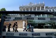 A group of journalists leaves the Palais Coburg Hotel, where the Iran nuclear talks are being held in Vienna, Austria on July 3, 2015