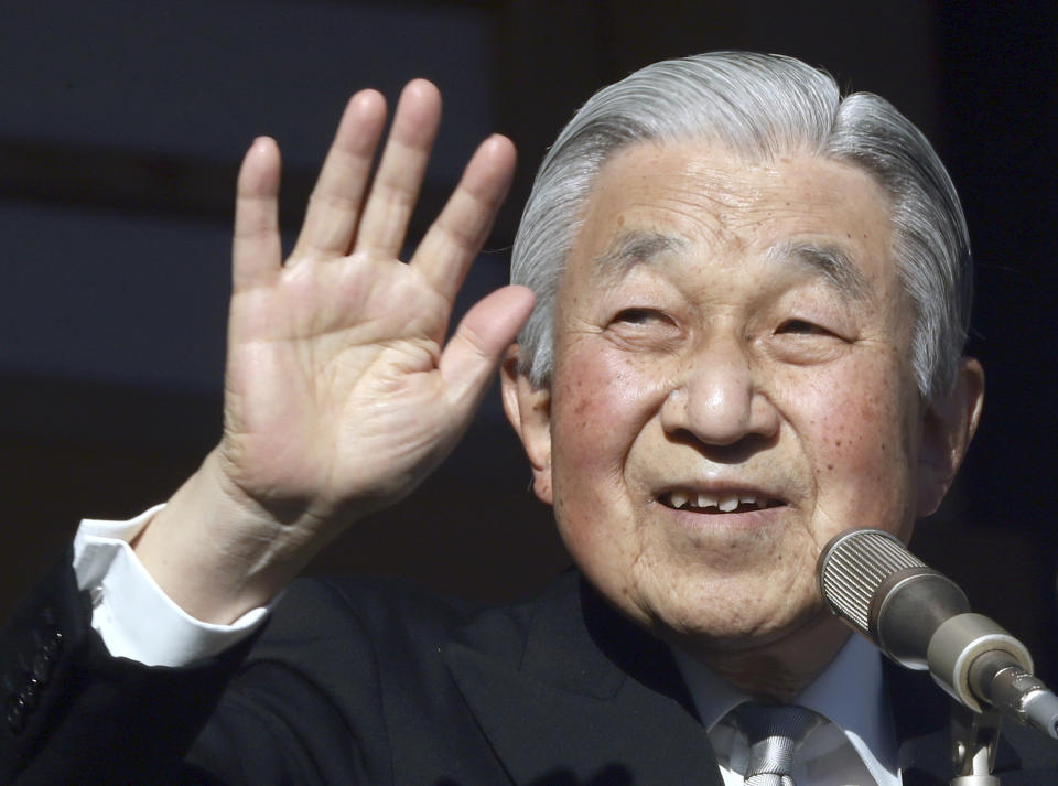 FILE - In this Jan. 2, 2019, file photo, Japan's Emperor Akihito waves to well-wishers from the bullet-proofed balcony during his New Year's public appearance with his family members at Imperial Palace in Tokyo. Akihito has devoted his 30-year reign to making amends for a war fought in his father’s name, while adapting the 1,500-year-old monarchy to draw the Imperial Family closer to the public. (AP Photo/Eugene Hoshiko, File)
