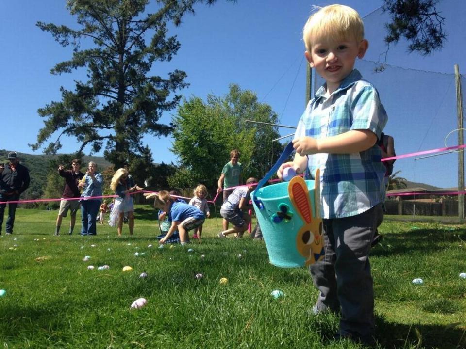 Jasper Gamble, 2, pauses briefly in his hunt for plastic Easter eggs in San Luis Obispo in 2017. Egg hunts are scheduled across San Luis Obispo County in April 2023.