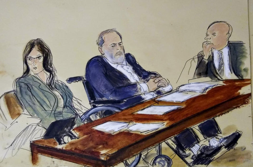 FILE - In this courtroom sketch, Harvey Weinstein, center, flanked by his defense attorneys, listens during his sentencing in a Manhattan courtroom, Wednesday, March 11, 2020, in New York. (Elizabeth Williams via AP, File)