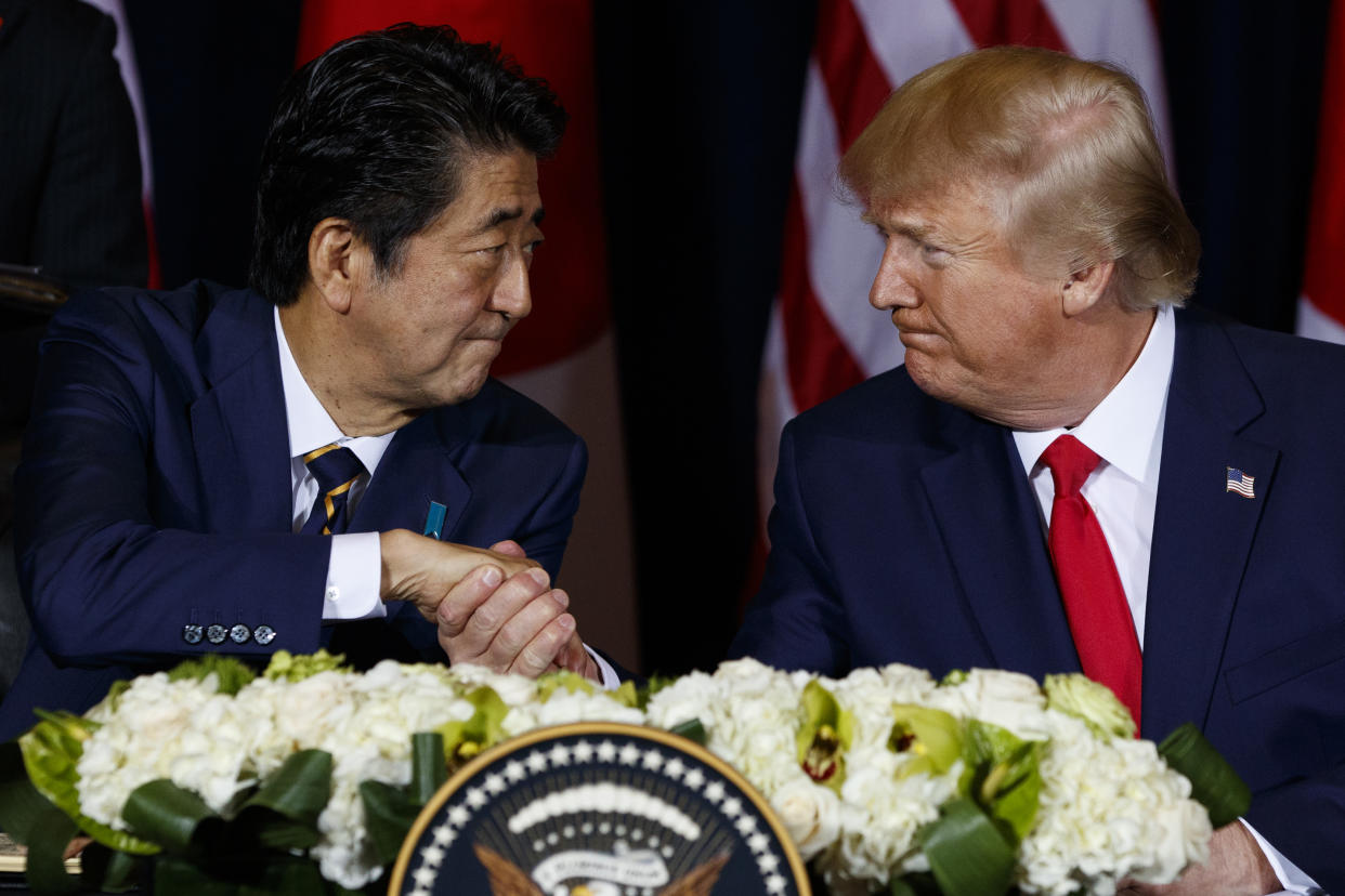 Japanese Prime Minister Shinzo Abe and President Trump shake hands in 2019.