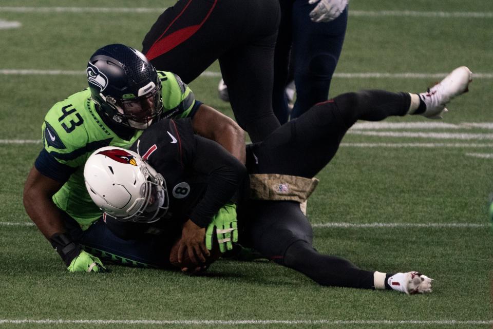 Seattle Seahawks defensive end Carlos Dunlap II sacksl Arizona Cardinals quarterback Kyler Murray on fourth down late in the second half an NFL football game, Thursday, Nov. 19, 2020, in Seattle. The Seahawks won 28-21. (AP Photo/Stephen Brashear)