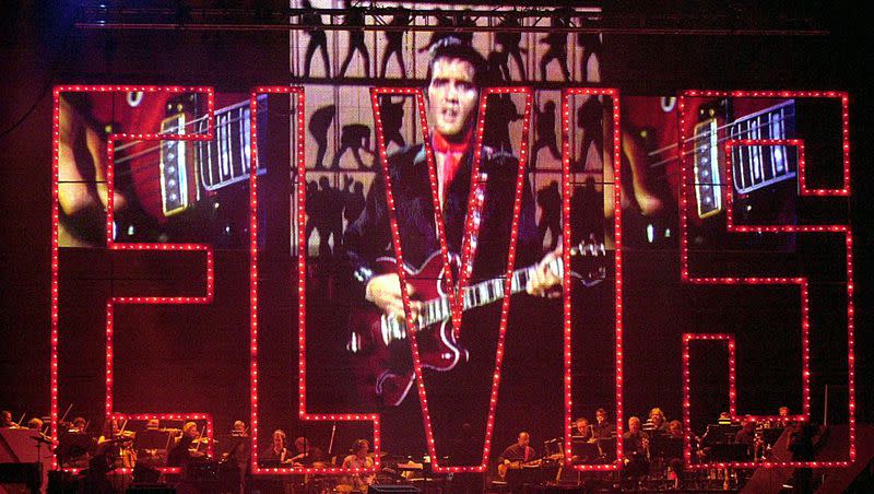 The late Elvis Presley sings via projection screen at the Elvis Presley 25th Anniversary Concert on Aug. 16, 2002, at the Pyramid in Memphis, Tenn. It’s been 45 years since Elvis died at the age of 42.