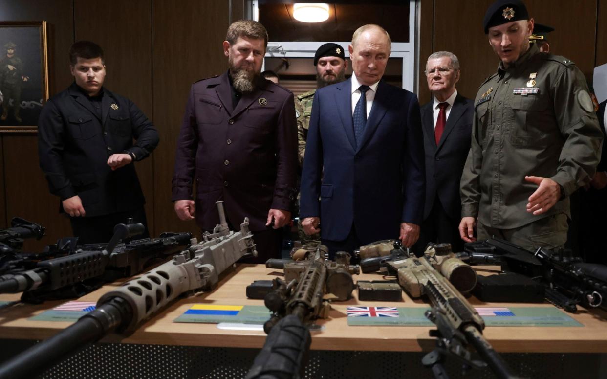 Vladimir Putin, accompanied by head of the Chechen Republic Ramzan Kadyrov, inspects Nato weapons captured in the battles in Ukraine