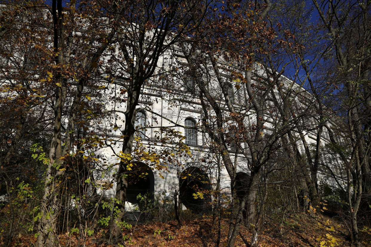 Colorful autumn trees stand outside the 'Congress Hall' at the 'Reichsparteigelande' (Nazi Party Rally Grounds) in Nuremberg, Germany, Wednesday, Nov. 18, 2020. Germany marks the 75th anniversary of the landmark Nuremberg trials of several Nazi leaders and in what is now seen as the birthplace of a new era of international law on Friday, Nov. 20, 2020. (AP Photo/Matthias Schrader)