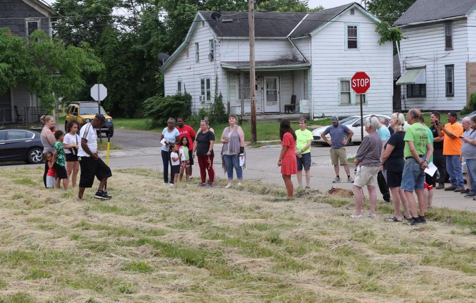 Sara Kurzinsky and her children, left, gathered Monday, June 17, 2024, for the groundbreaking ceremony for their new home at Green Avenue and Noble Street in Alliance.