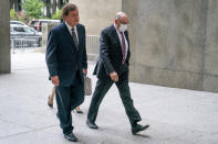 The Trump Organization's former Chief Financial Officer Allen Weisselberg, right, arrives at court, Friday, Aug. 12, 2022, in New York. (AP Photo/John Minchillo)